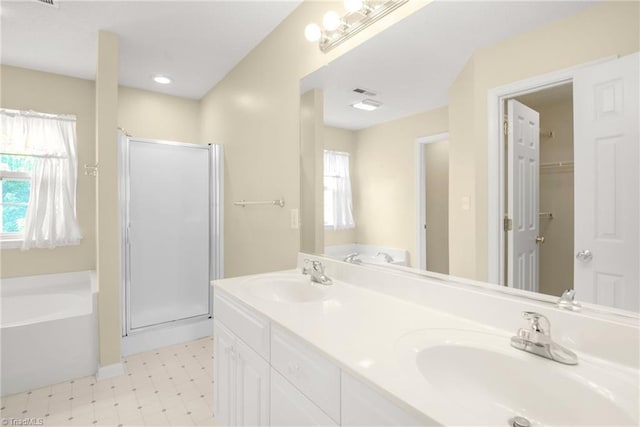 131 Hickory Creek Ct, Winston-Salem, NC 27107 - full bathroom with a shower stall, a garden tub, double vanity, and tile patterned floors