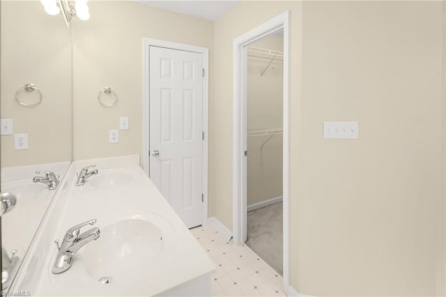 131 Hickory Creek Ct, Winston-Salem, NC 27107 - bathroom featuring double vanity, tile patterned floors, and a spacious closet
