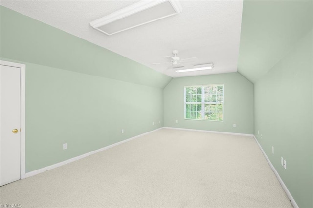 131 Hickory Creek Ct, Winston-Salem, NC 27107 - additional living space with ceiling fan, vaulted ceiling, light colored carpet, and a textured ceiling