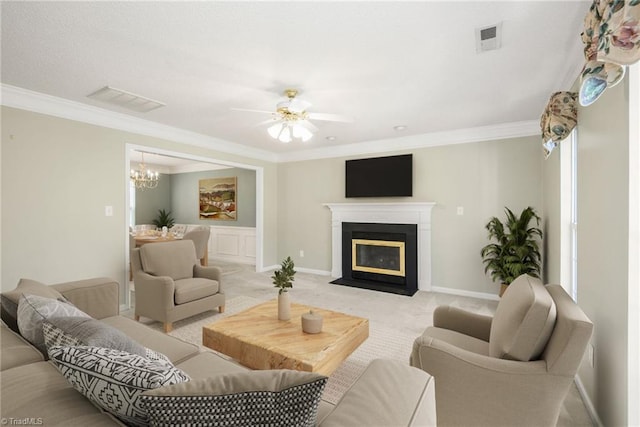 131 Hickory Creek Ct, Winston-Salem, NC 27107 - living area featuring ornamental molding, a ceiling fan, carpet floors, a chandelier, and a fireplace with flush hearth