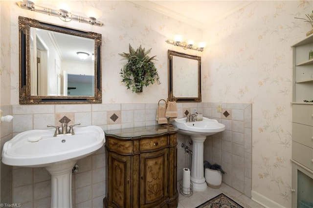 bathroom featuring ornamental molding and dual sinks