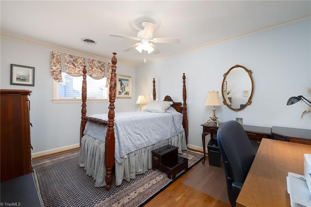 bedroom featuring ornamental molding, hardwood / wood-style floors, and ceiling fan