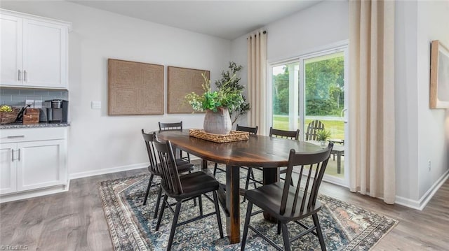 dining area featuring wood-type flooring