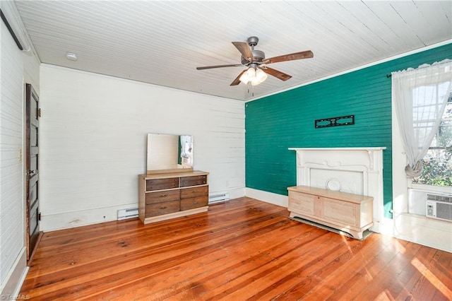 bedroom featuring ornamental molding, a baseboard radiator, a ceiling fan, and hardwood / wood-style flooring