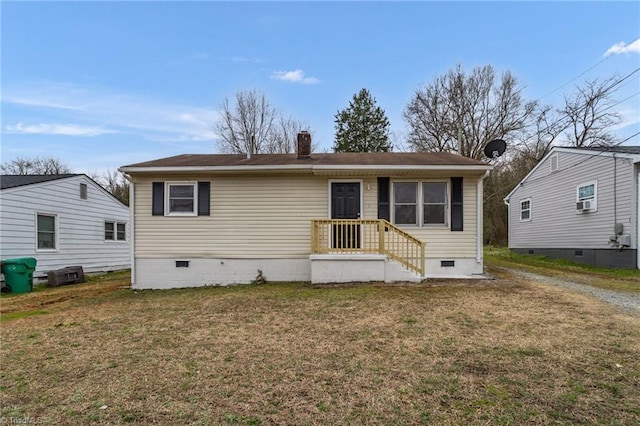 view of front of house featuring crawl space, a chimney, and a front lawn