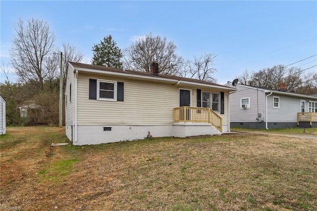 view of front of house with crawl space, a chimney, and a front lawn