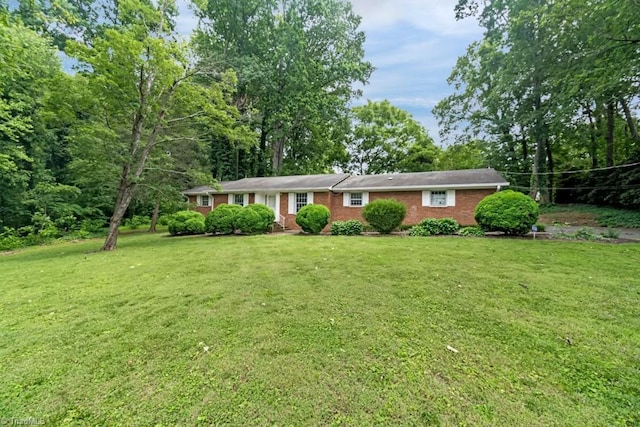 1281 Woodbrook Dr, Kernersville, NC 27284 - ranch-style home with a front lawn and brick siding