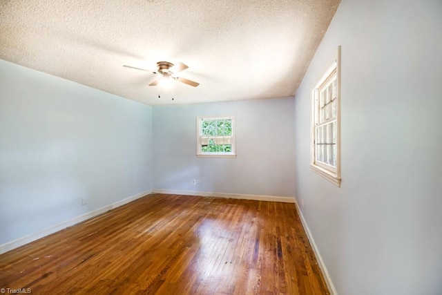 1281 Woodbrook Dr, Kernersville, NC 27284 - empty room with ceiling fan, hardwood / wood-style floors, baseboards, and a textured ceiling