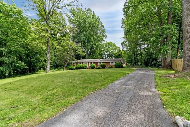 1281 Woodbrook Dr, Kernersville, NC 27284 - ranch-style home featuring a front yard and driveway