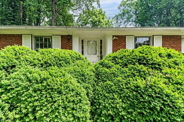 1281 Woodbrook Dr, Kernersville, NC 27284 - doorway to property featuring brick siding