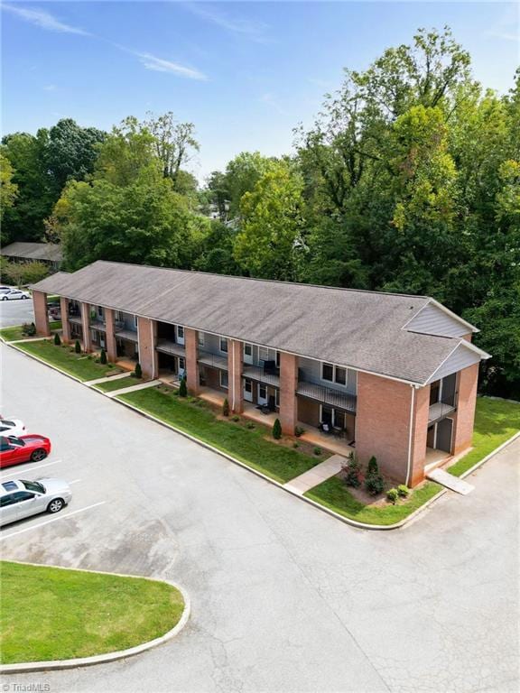 view of property featuring uncovered parking