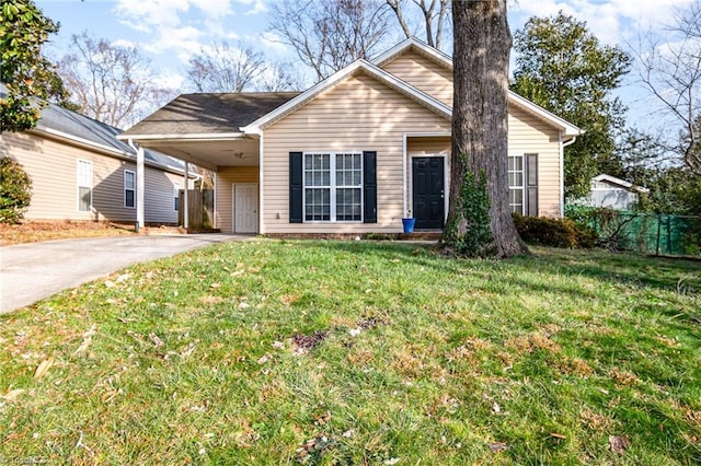 view of front facade with a front yard and a carport