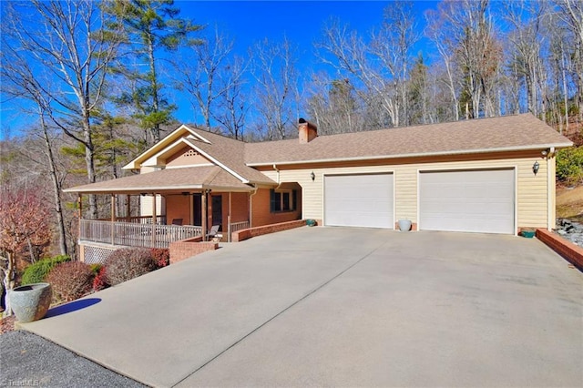 view of front of home with a porch and a garage