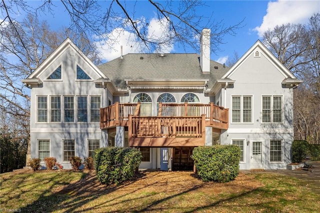5005 Marble Arch Rd, Winston-Salem, NC 27104 - rear view of property with stucco siding, a wooden deck, a chimney, and a lawn
