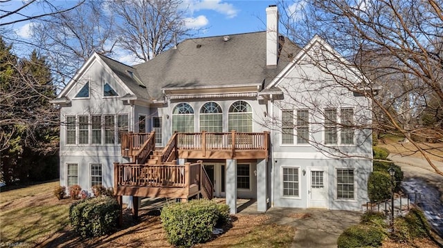 5005 Marble Arch Rd, Winston-Salem, NC 27104 - rear view of house with a chimney, a wooden deck, a patio, stairs, and stucco siding