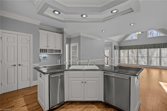 5005 Marble Arch Rd, Winston-Salem, NC 27104 - kitchen featuring stainless steel dishwasher, a sink, a tray ceiling, a center island with sink, and recessed lighting
