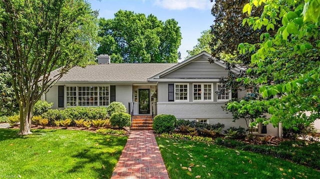 1205 Country Club Dr, Greensboro, NC 27408 - ranch-style house with brick siding, a chimney, and a front yard