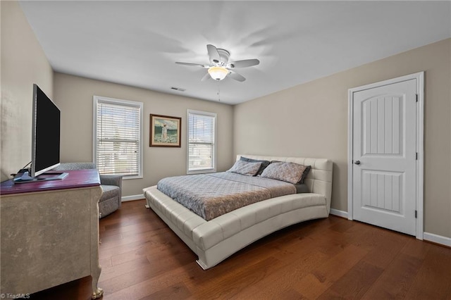 bedroom featuring dark hardwood / wood-style flooring and ceiling fan