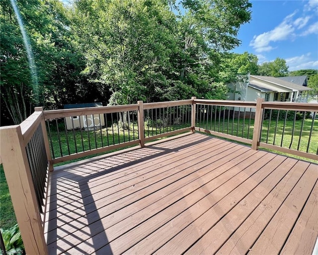deck featuring a lawn