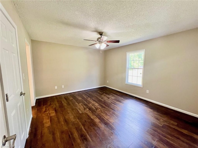 unfurnished bedroom with wood finished floors, baseboards, a textured ceiling, and ceiling fan