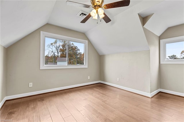 bonus room with ceiling fan, light hardwood / wood-style flooring, and lofted ceiling