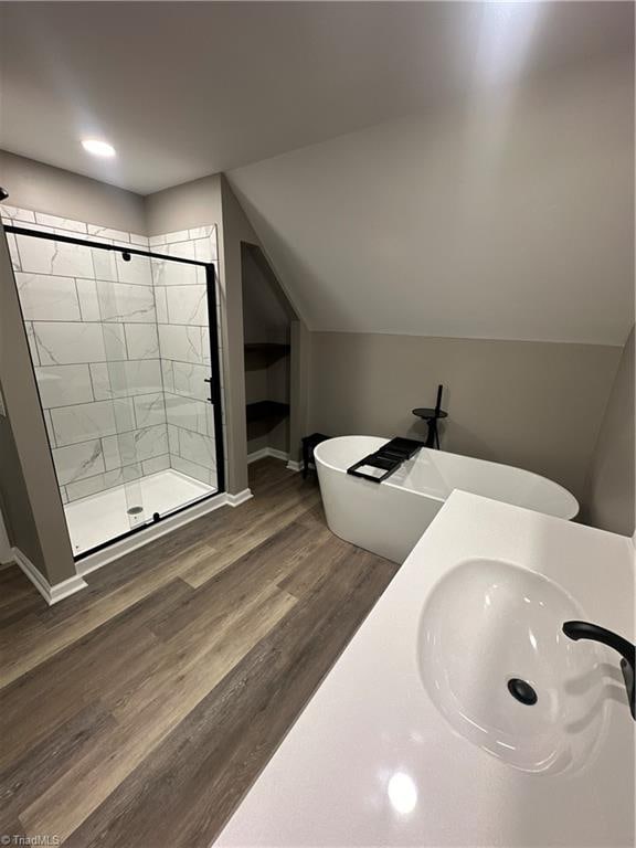 bathroom featuring hardwood / wood-style floors, vanity, and an enclosed shower