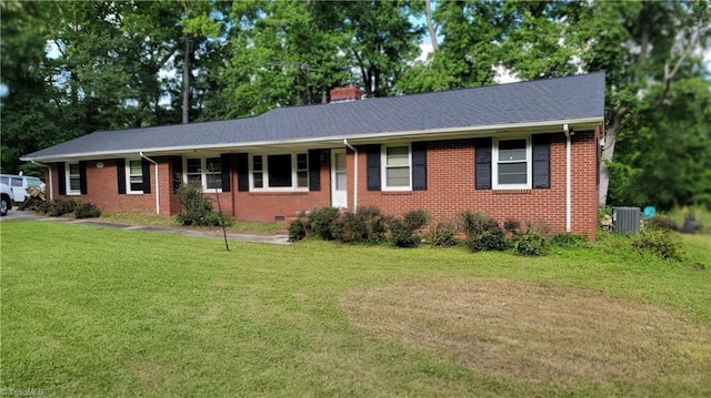 1428 Wiley Lewis Rd, Greensboro, NC 27406 - single story home with a front lawn, brick siding, a chimney, and central AC