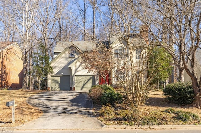 view of front of property with concrete driveway