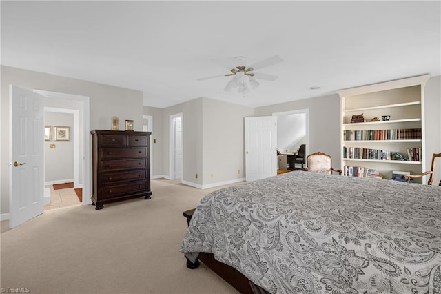 bedroom with carpet, baseboards, and a ceiling fan