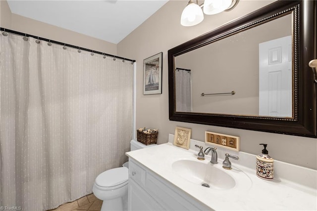 full bathroom featuring toilet and vanity