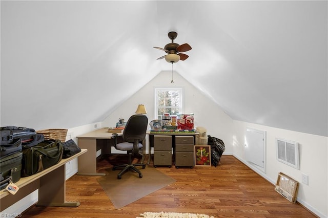 office space with lofted ceiling, visible vents, ceiling fan, and wood finished floors