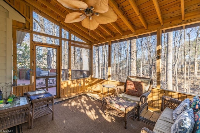 sunroom / solarium featuring wood ceiling, vaulted ceiling with beams, and ceiling fan