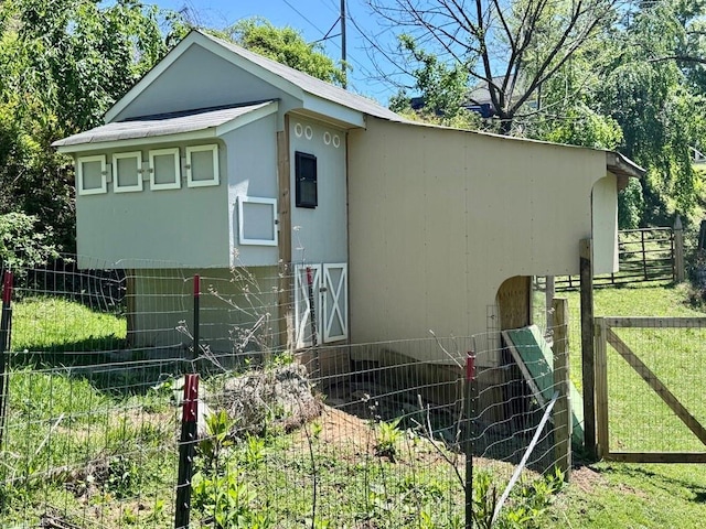 view of home's exterior with fence
