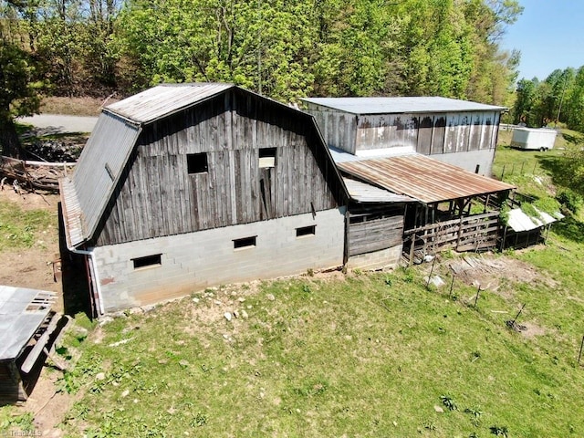 view of barn with a wooded view