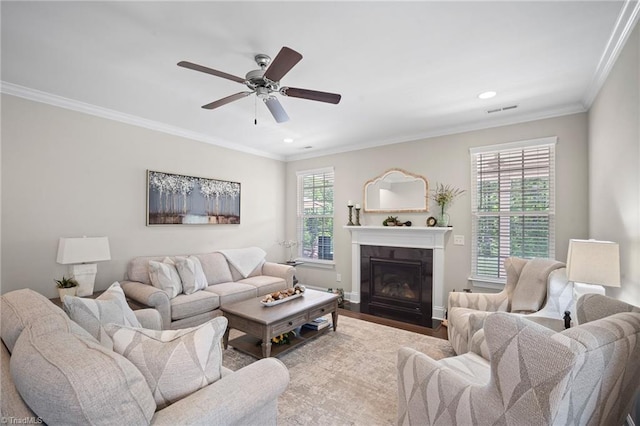 1417 Blooming Mountain Way, Kernersville, NC 27284 - living area with a ceiling fan, visible vents, crown molding, a fireplace with flush hearth, and recessed lighting