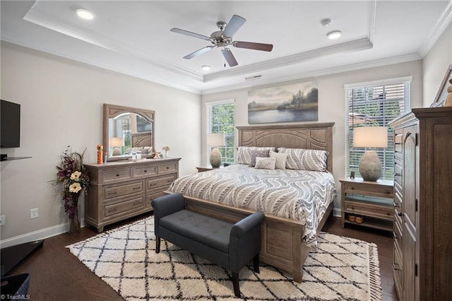 1417 Blooming Mountain Way, Kernersville, NC 27284 - bedroom with ornamental molding, baseboards, a raised ceiling, a ceiling fan, and dark wood finished floors