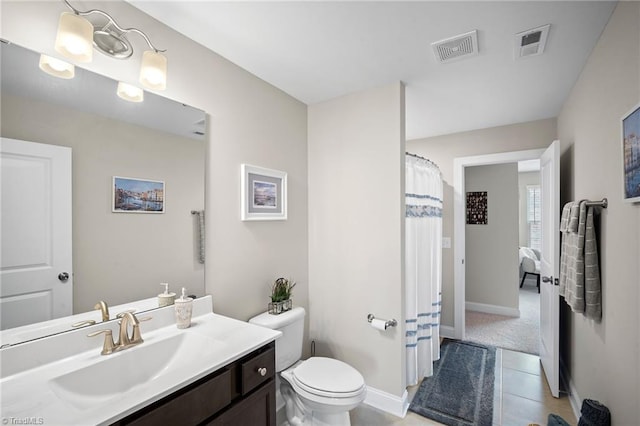 1417 Blooming Mountain Way, Kernersville, NC 27284 - bathroom with vanity, baseboards, toilet, and visible vents