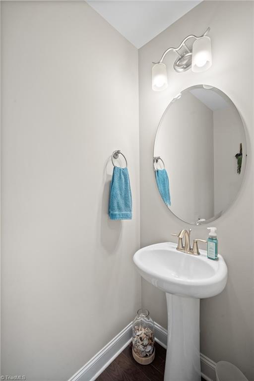 1417 Blooming Mountain Way, Kernersville, NC 27284 - bathroom featuring baseboards and wood finished floors
