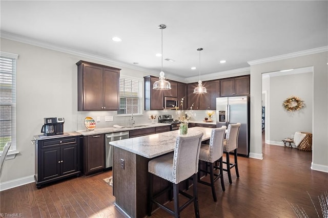 1417 Blooming Mountain Way, Kernersville, NC 27284 - kitchen with dark brown cabinetry, tasteful backsplash, a sink, dark wood-style floors, and stainless steel appliances