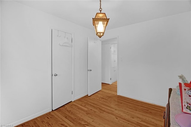 spare room featuring light hardwood / wood-style floors