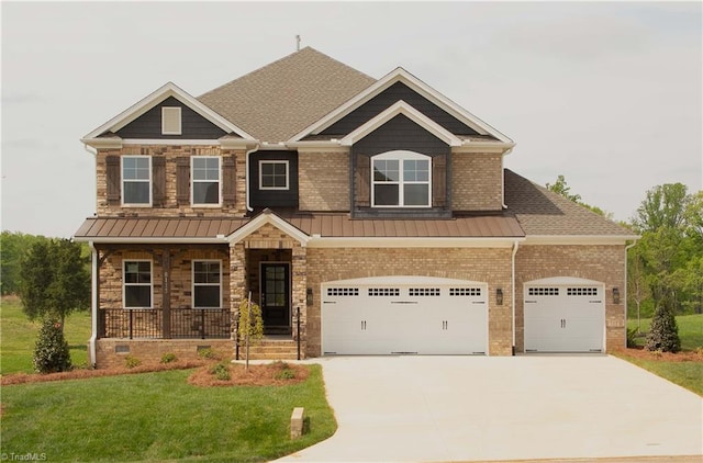 8113 Simon Dr Lot 38, Stokesdale, NC 27357 - craftsman inspired home with covered porch, a front lawn, driveway, a standing seam roof, and a garage