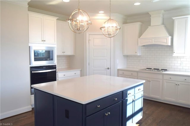8113 Simon Dr Lot 38, Stokesdale, NC 27357 - kitchen with oven, built in microwave, premium range hood, cooktop, and a chandelier