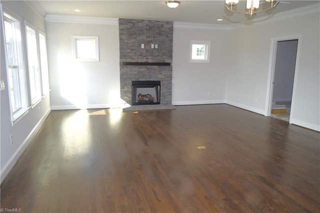 8113 Simon Dr Lot 38, Stokesdale, NC 27357 - unfurnished living room featuring ornamental molding, baseboards, dark wood-style floors, a chandelier, and a stone fireplace