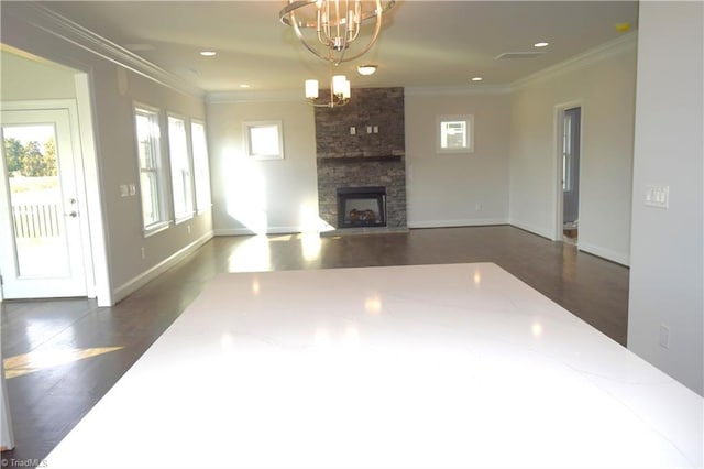 8113 Simon Dr Lot 38, Stokesdale, NC 27357 - unfurnished living room with healthy amount of natural light, ornamental molding, dark wood finished floors, a chandelier, and a fireplace