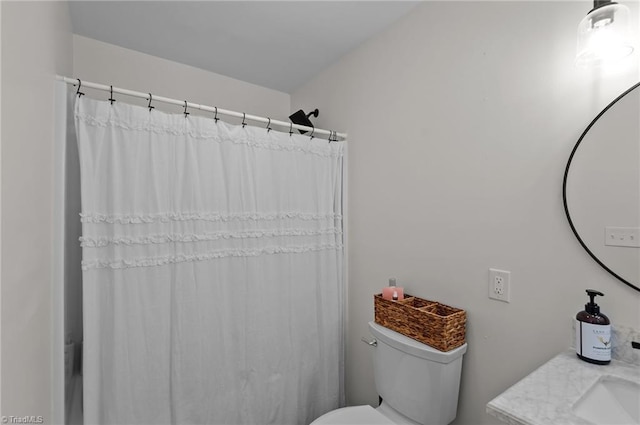 2281 Quarter Rd, Swanquarter, NC 27885 - bathroom featuring toilet, a sink, and a shower with shower curtain