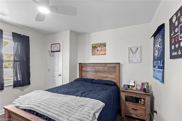 2281 Quarter Rd, Swanquarter, NC 27885 - bedroom with baseboards, a ceiling fan, and dark wood-type flooring