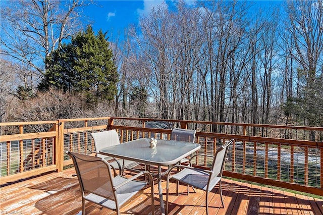 wooden deck with outdoor dining area