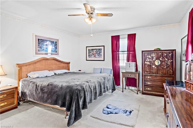 bedroom with light carpet and ceiling fan