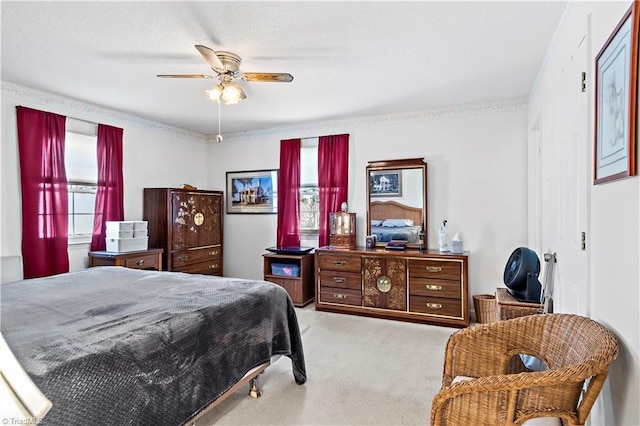 bedroom with ceiling fan, multiple windows, and light colored carpet