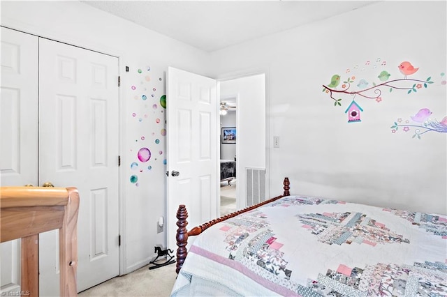 bedroom with visible vents and light colored carpet